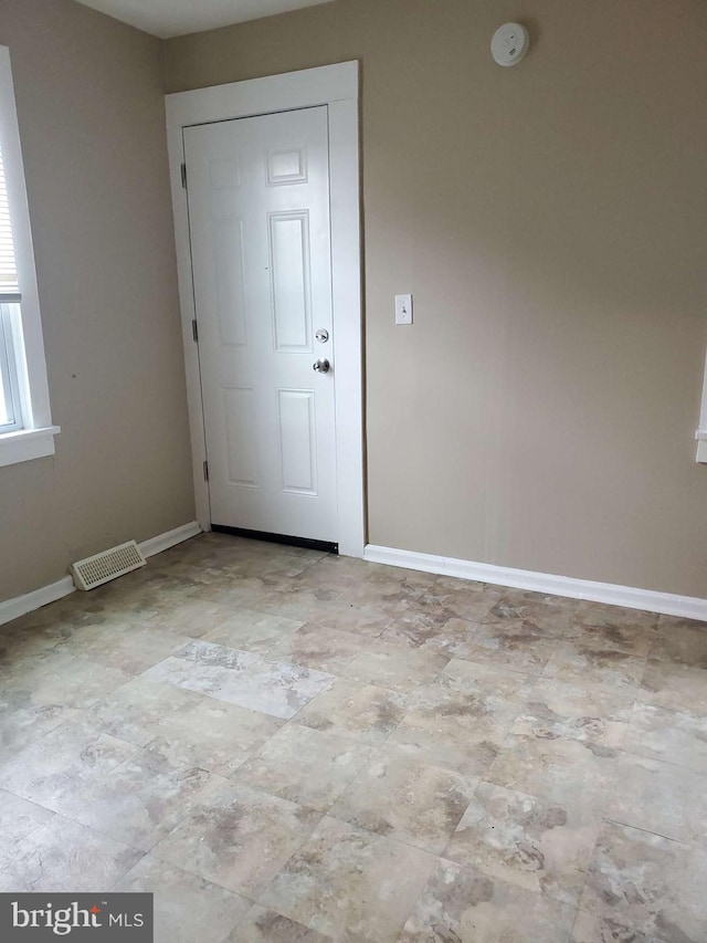 view of tiled spare room