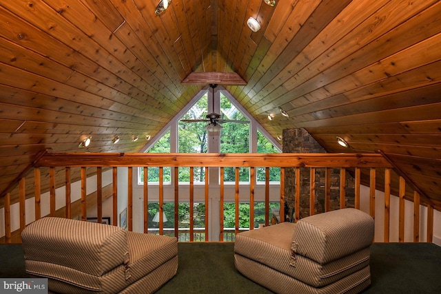 living area with lofted ceiling, ceiling fan, and wooden ceiling