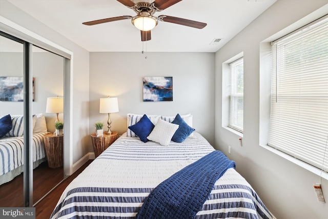 bedroom with ceiling fan and dark hardwood / wood-style flooring