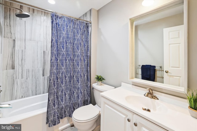 full bathroom featuring vanity, shower / bath combination with curtain, and toilet