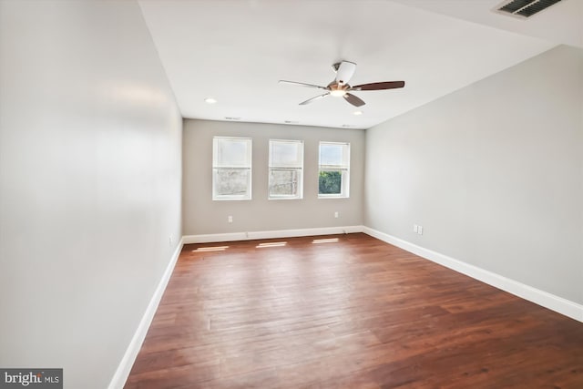 unfurnished room featuring ceiling fan and dark hardwood / wood-style flooring