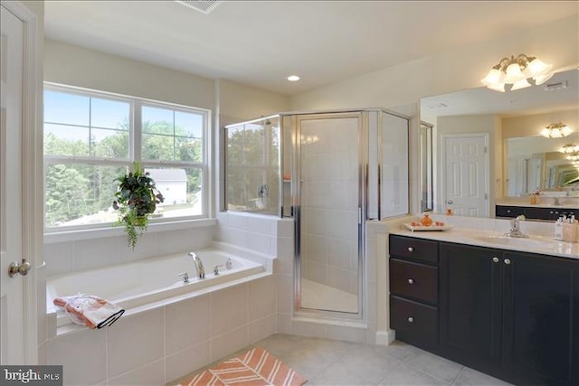 bathroom with tile patterned flooring, vanity, a healthy amount of sunlight, and independent shower and bath