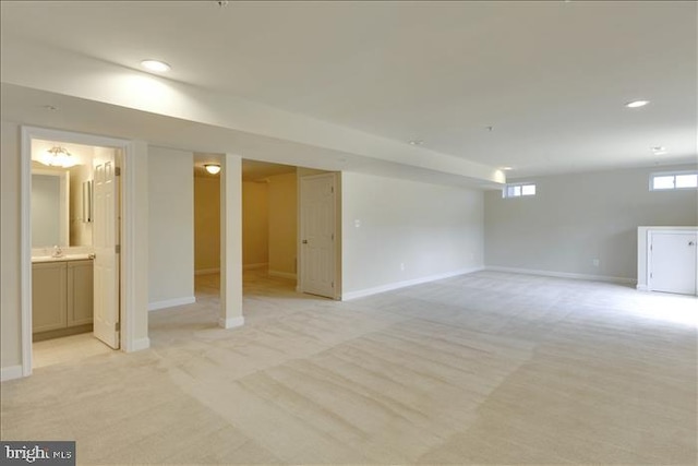 basement with light colored carpet