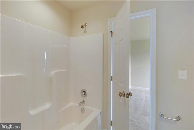 bathroom with bathing tub / shower combination