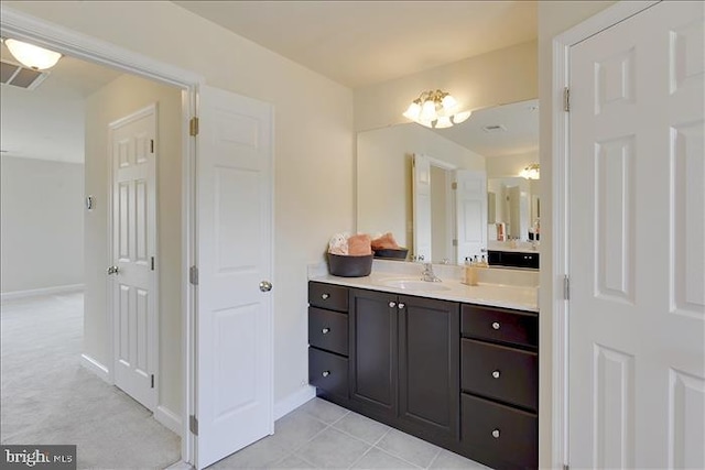 bathroom featuring tile patterned flooring and vanity