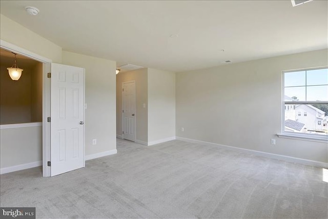 empty room with light colored carpet