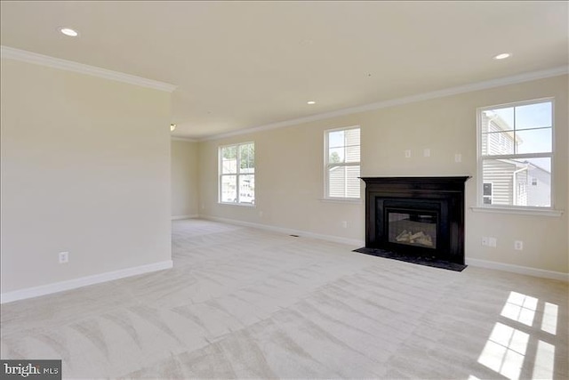 unfurnished living room featuring crown molding and light carpet