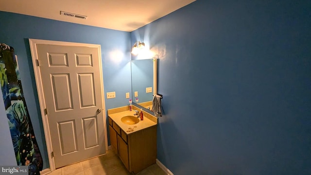 bathroom featuring tile patterned floors and vanity