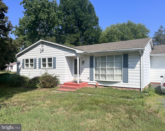 single story home featuring a front yard