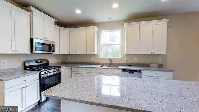 kitchen featuring white cabinetry, sink, and stainless steel appliances