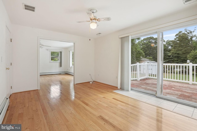 empty room with ceiling fan, a baseboard radiator, and light wood-type flooring