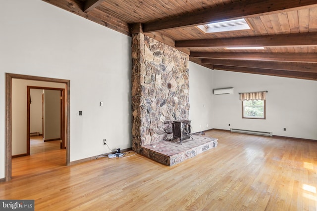 unfurnished living room featuring wooden ceiling, a wood stove, a baseboard radiator, lofted ceiling with skylight, and an AC wall unit