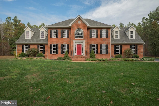 colonial home with a front lawn