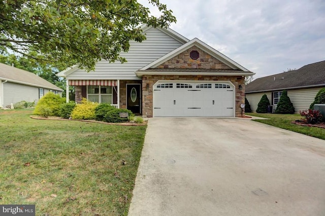 craftsman inspired home with a garage and a front lawn