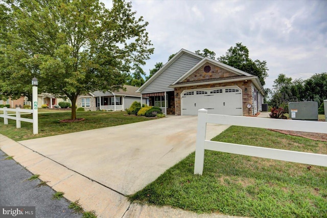 view of front of home with a front lawn and a garage