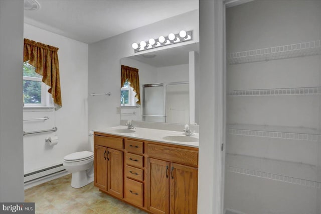 bathroom featuring vanity, a baseboard radiator, toilet, and a shower with shower door