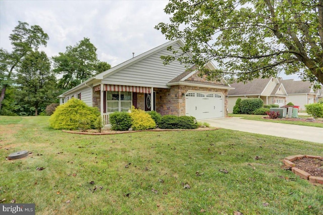 view of front of property with a front yard and a garage