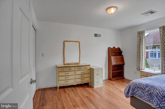 bedroom with light hardwood / wood-style floors