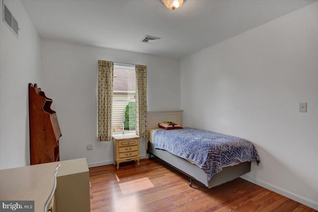 bedroom with light hardwood / wood-style flooring