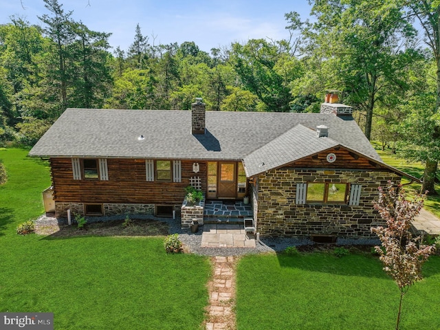 log-style house with a front yard