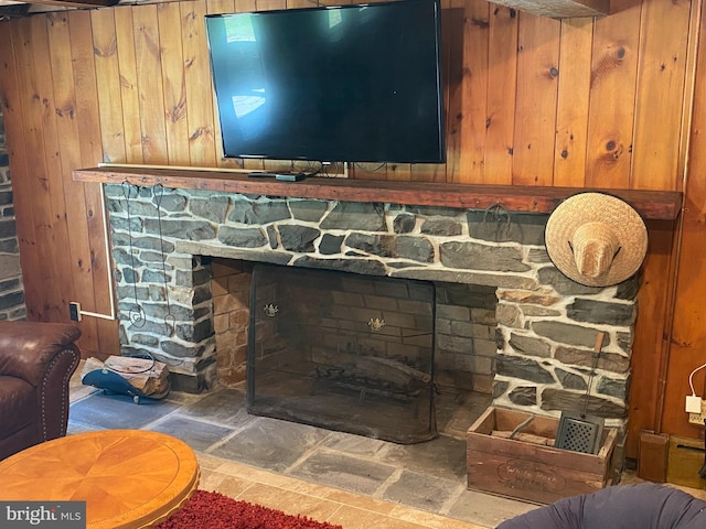 details with a fireplace and wooden walls