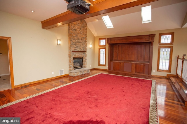 unfurnished living room with dark hardwood / wood-style flooring and a fireplace