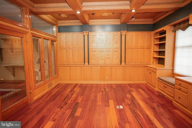 empty room with beamed ceiling, ornamental molding, coffered ceiling, and hardwood / wood-style flooring