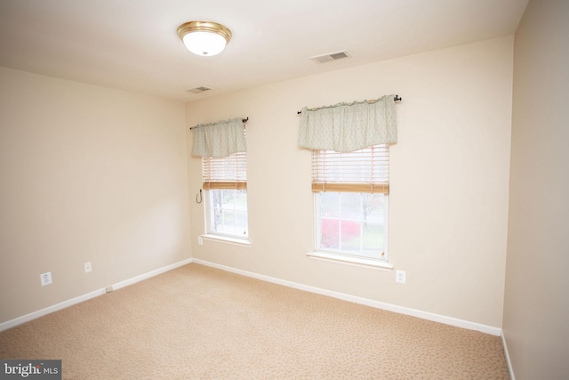 spare room with carpet floors