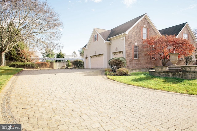 view of side of home with a garage and a yard