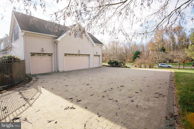 view of side of home with a garage