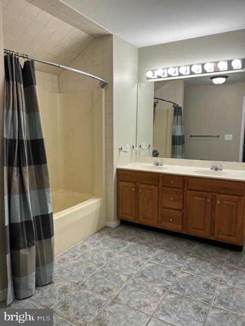 bathroom with vanity and shower / bathtub combination with curtain