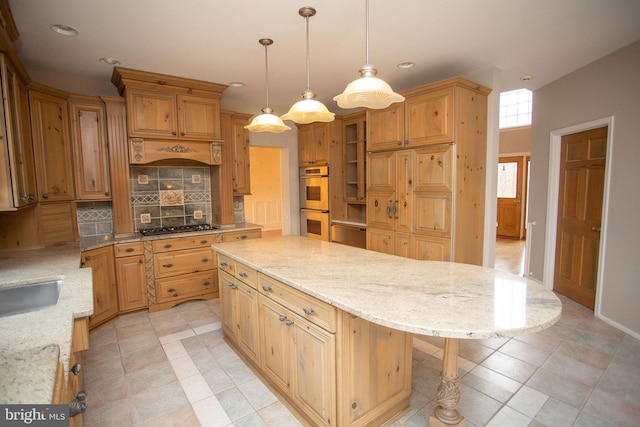 kitchen featuring appliances with stainless steel finishes, backsplash, light stone counters, a center island, and hanging light fixtures