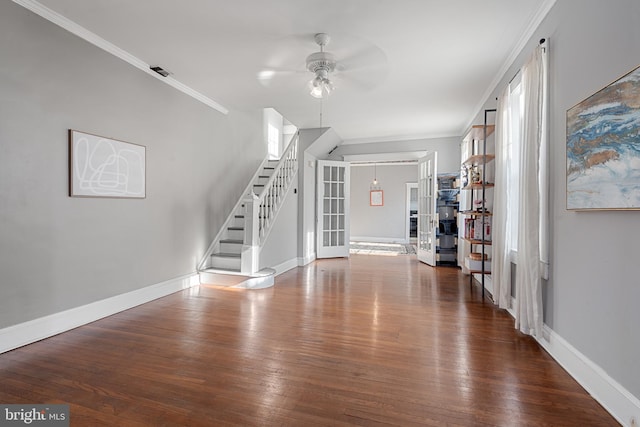 unfurnished living room with french doors, dark hardwood / wood-style floors, ceiling fan, and ornamental molding