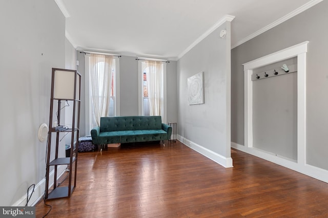 unfurnished room with ornamental molding and dark wood-type flooring