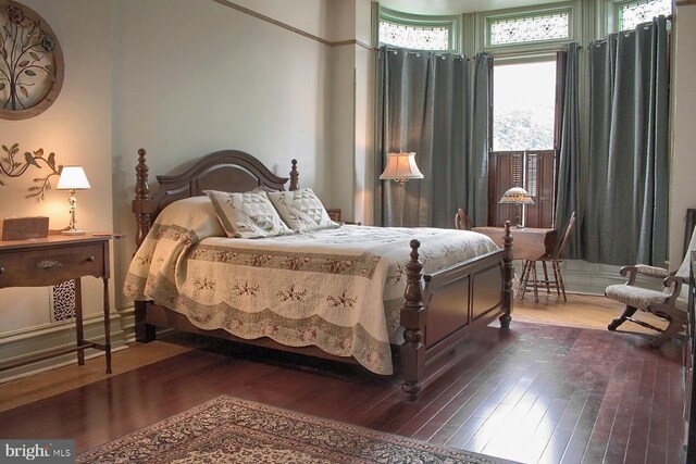 bedroom featuring dark hardwood / wood-style floors