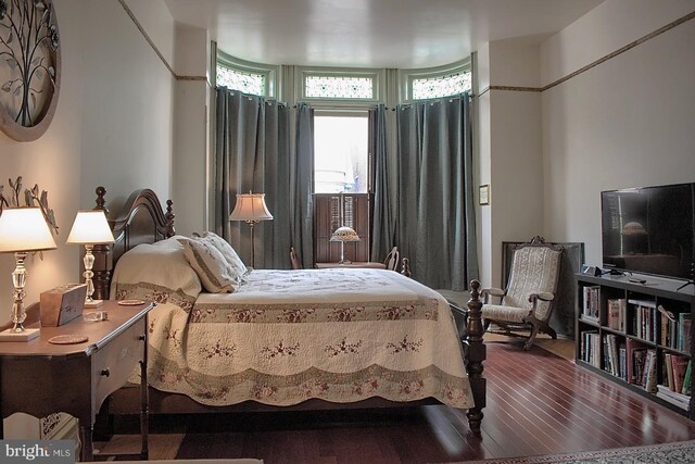 bedroom featuring hardwood / wood-style floors