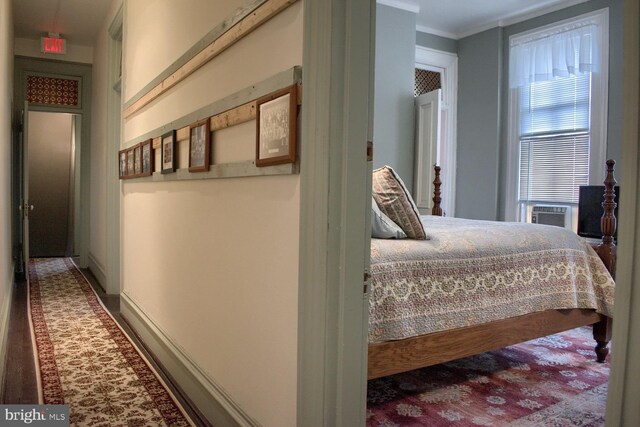 bedroom featuring cooling unit and crown molding