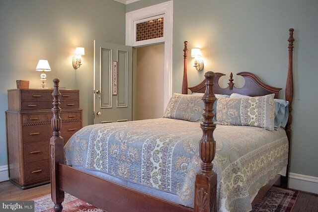 bedroom with wood-type flooring