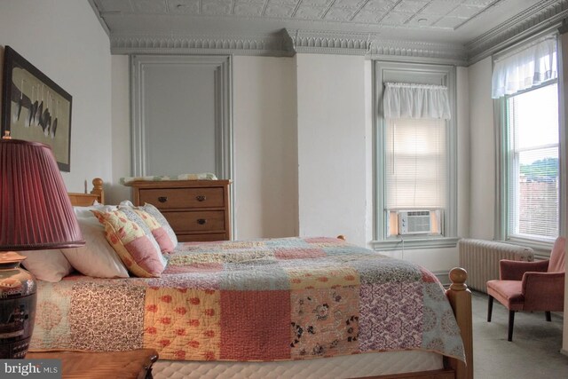 carpeted bedroom featuring radiator, crown molding, cooling unit, and multiple windows