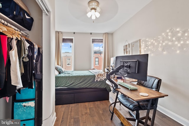 bedroom featuring dark hardwood / wood-style floors and ceiling fan