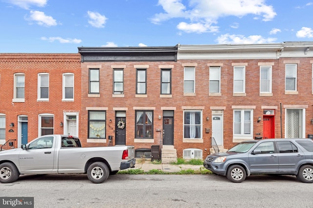 view of property with brick siding