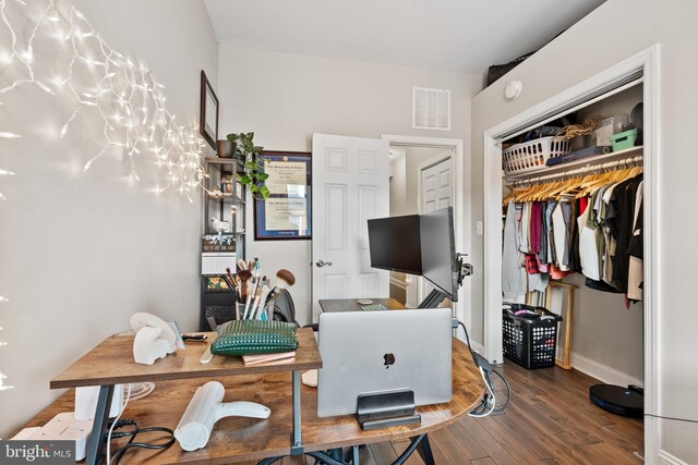 office with dark hardwood / wood-style floors