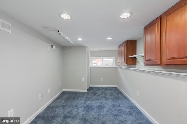 basement with dark carpet