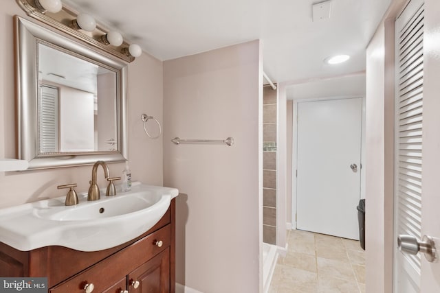 bathroom featuring tile patterned flooring and vanity