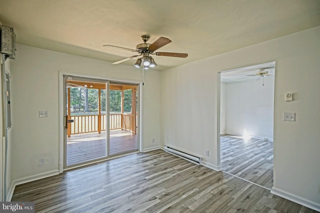 unfurnished room featuring ceiling fan, wood-type flooring, and a baseboard radiator