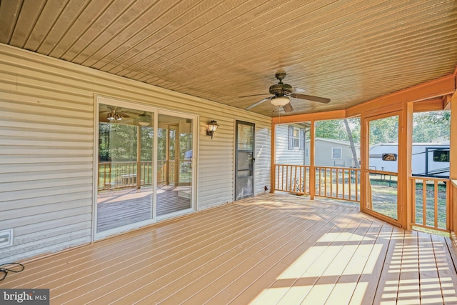 unfurnished sunroom with wood ceiling