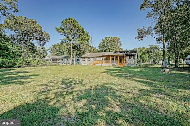 view of yard featuring a wooden deck