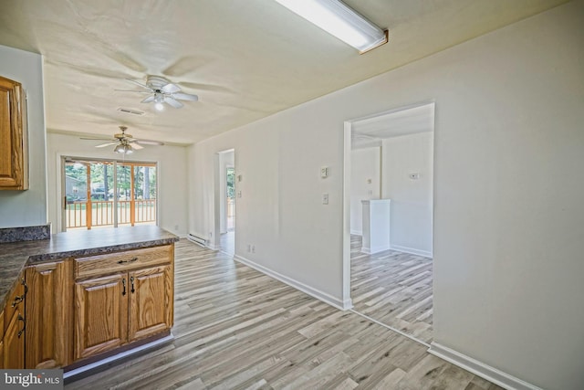 kitchen featuring ceiling fan and light wood-type flooring