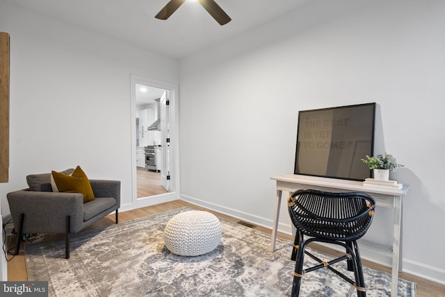 office space featuring light wood-type flooring and ceiling fan