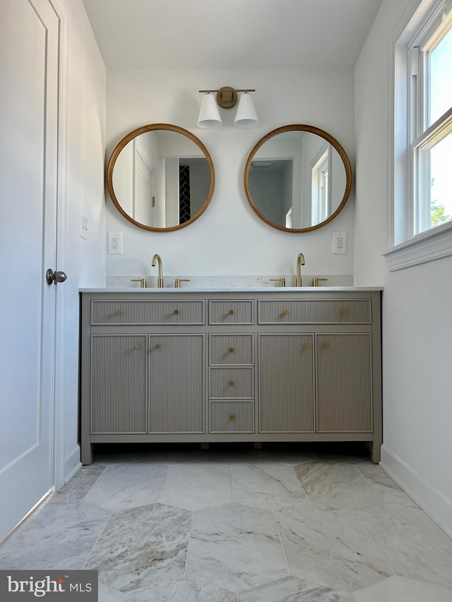 bathroom featuring double vanity and tile patterned flooring